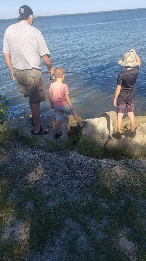 Grandpa Lee and the boys fishing in Cocoa, Florida.